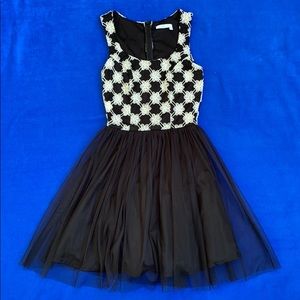 Black dress with tulle and embroidered flowers